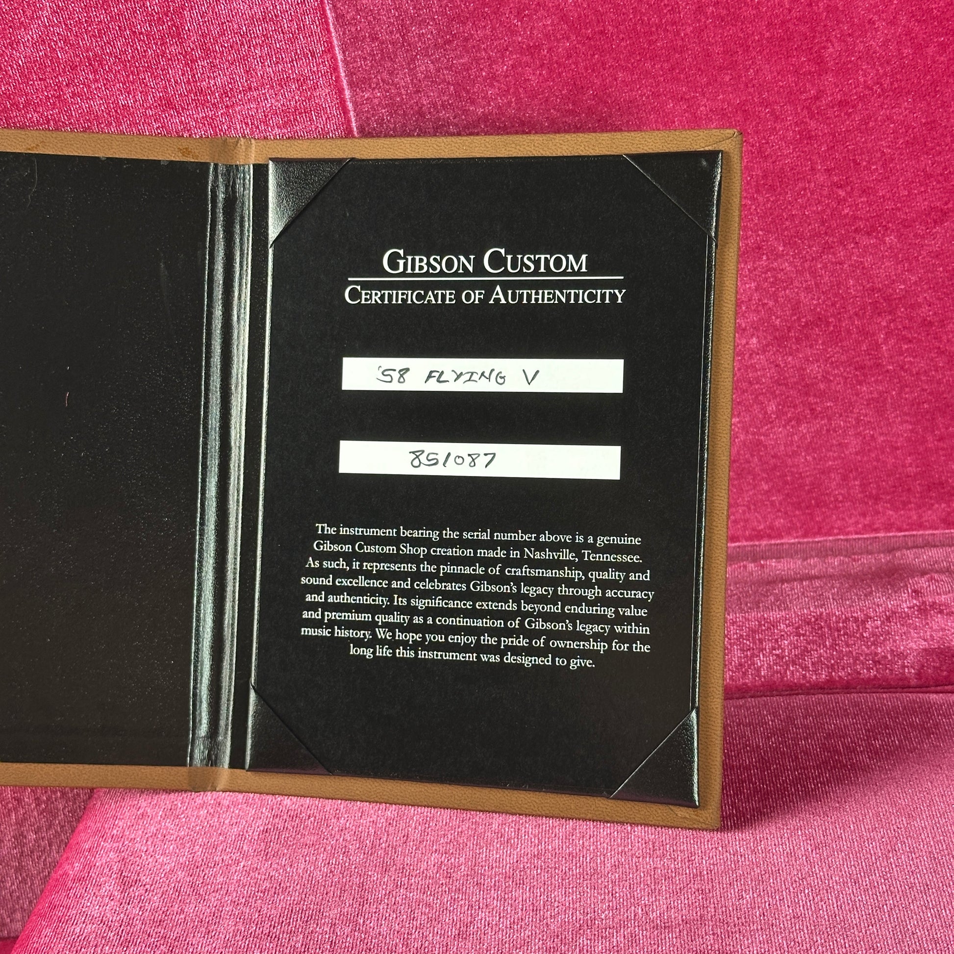 Gibson Custom Certificate of Authenticity on a pink background