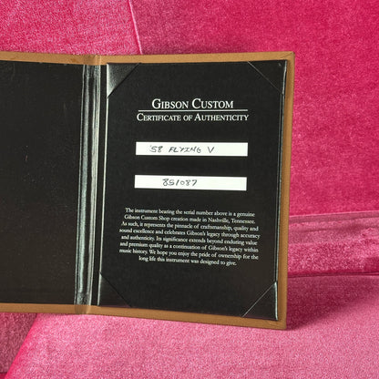 Gibson Custom Certificate of Authenticity on a pink background