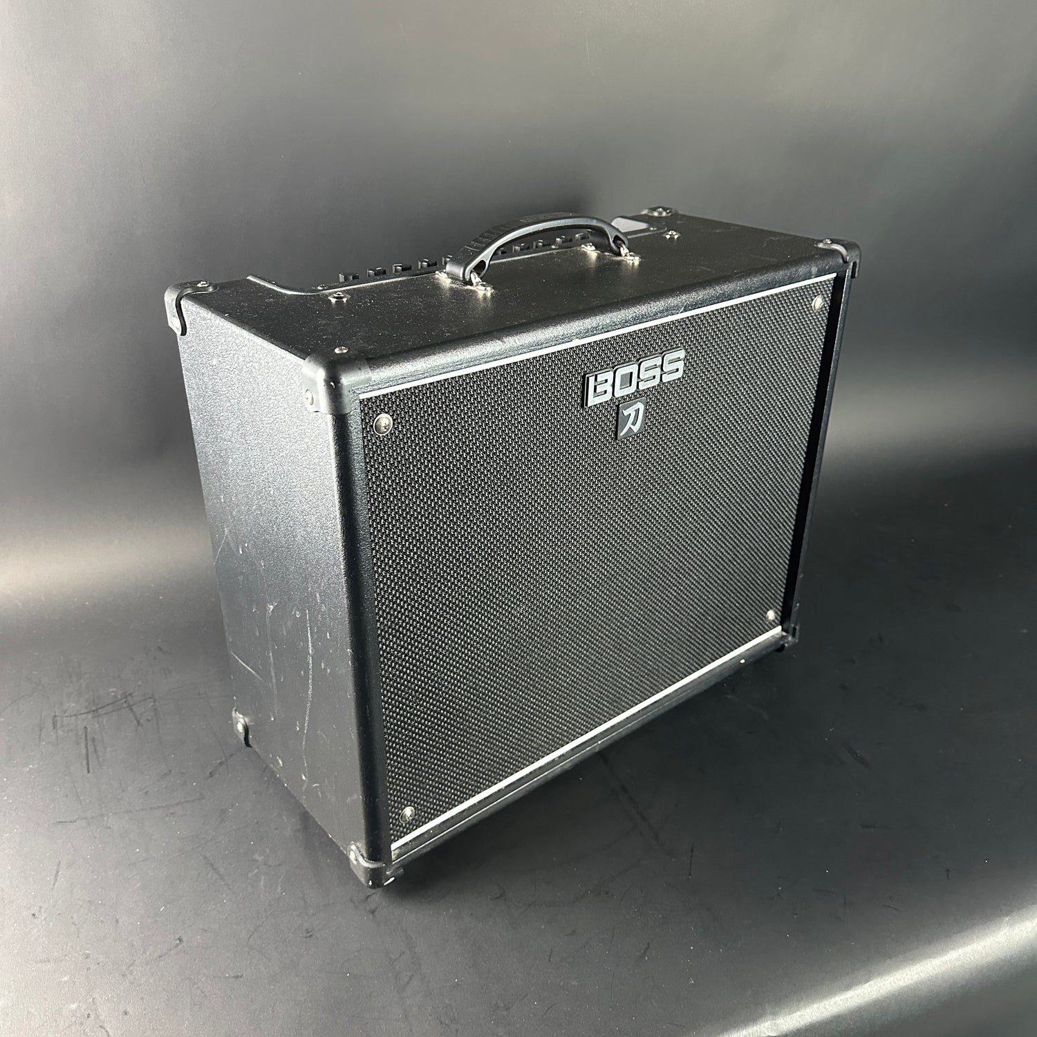 Boss guitar amplifier on a gray background