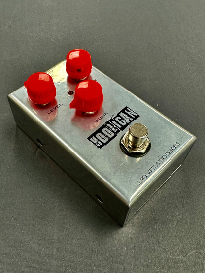 Guitar effects pedal with red knobs and 'Koboy' branding on a gray background