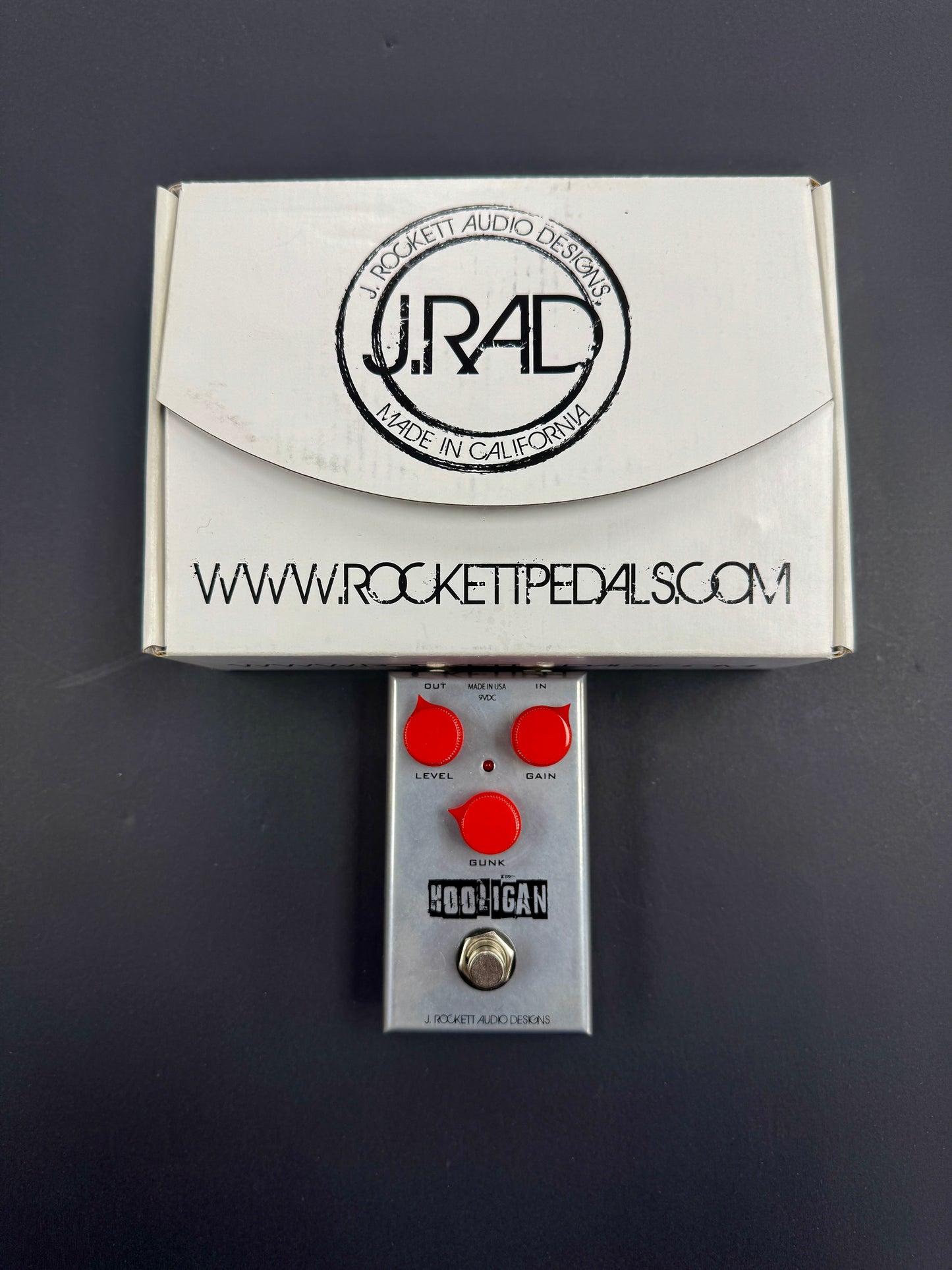 Rocket Pedals guitar effects pedal with packaging on a dark background