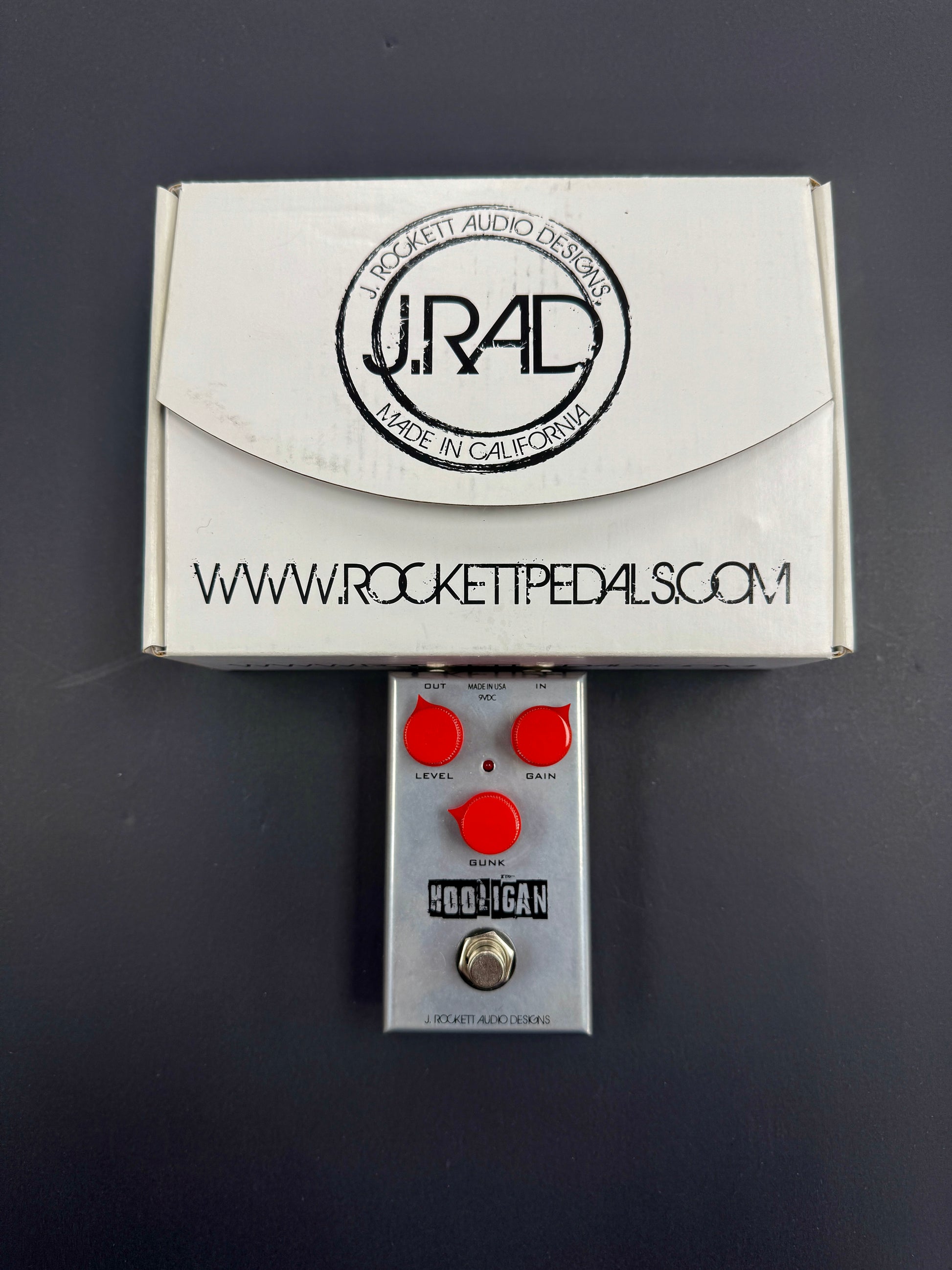 Rocket Pedals guitar effects pedal with packaging on a dark background