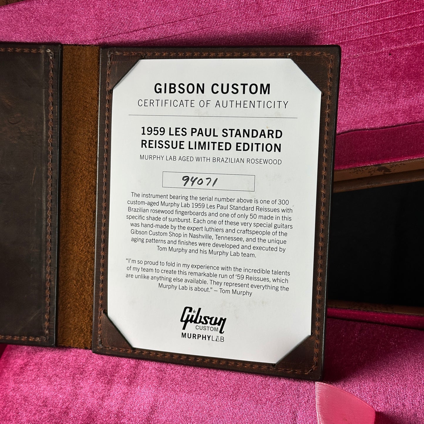 Gibson Custom Certificate of Authenticity for a 1959 Les Paul Standard Reissue Limited Edition on a pink background