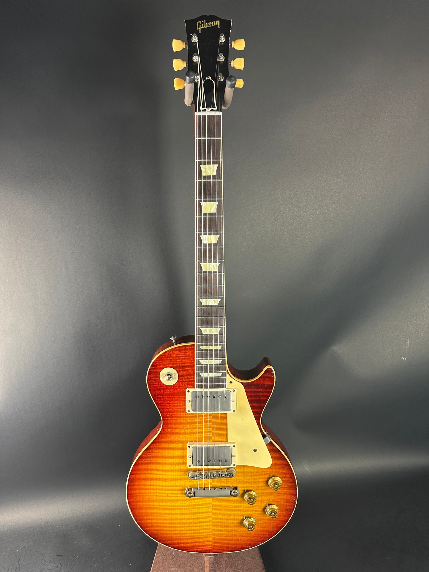 Electric guitar with a sunburst finish on a dark gray background