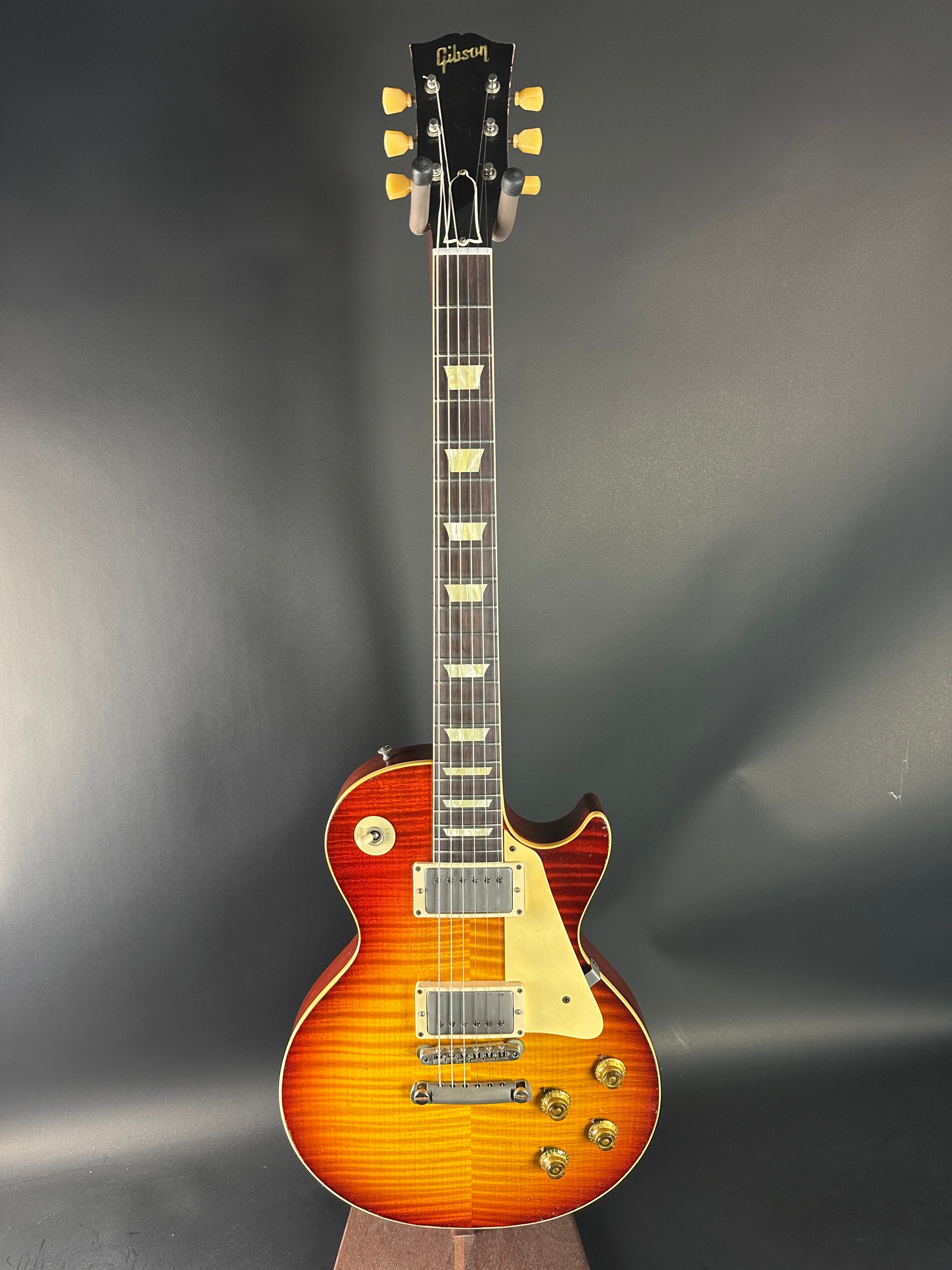 Electric guitar with a sunburst finish on a dark gray background