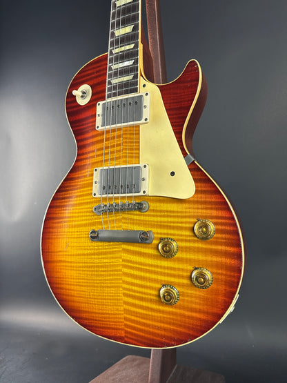 Electric guitar with a sunburst finish on a dark background