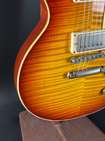 Close-up of a sunburst electric guitar on a dark background