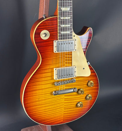 Electric guitar with a sunburst finish on a dark background
