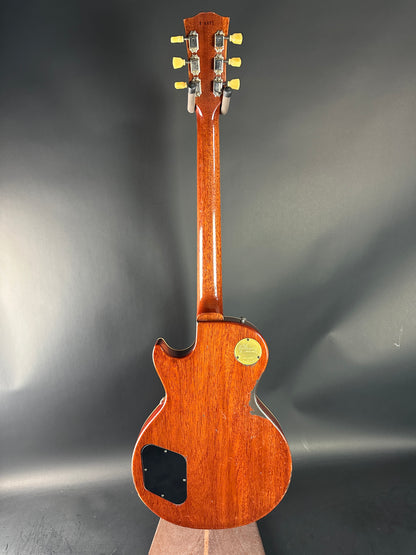 Wooden electric guitar on a dark gray background