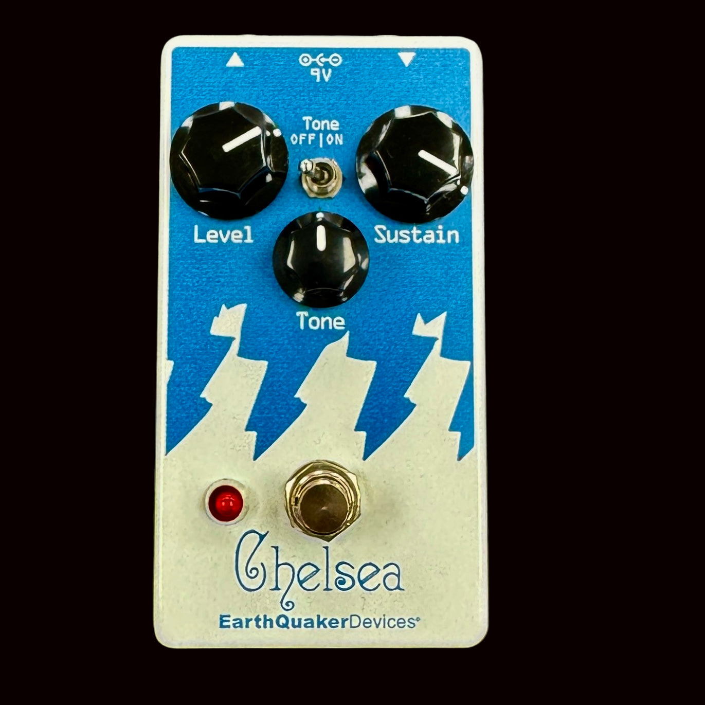 Guitar effects pedal with blue and white design on a gray background