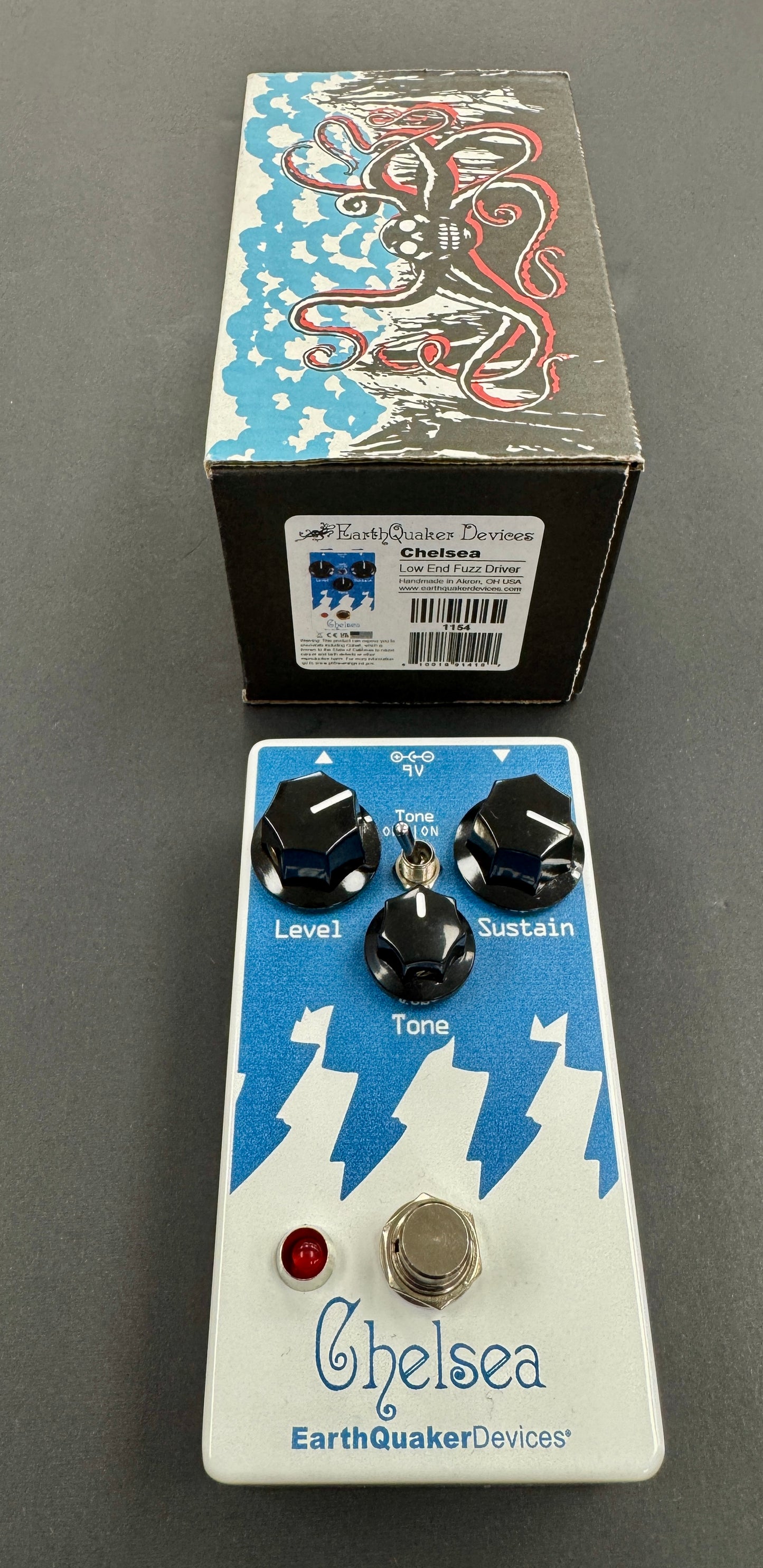 Guitar effects pedal with 'Chelsea' branding and 'EarthQuaker Devices' packaging on a gray background