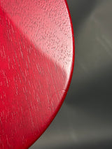 Close-up of a red textured surface with a dark gray background