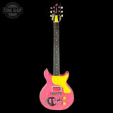 A pink electric guitar with a bright yellow pickguard and a distressed finish, shown against a solid black background. A Tone Shop watermark is visible in the top-left corner.