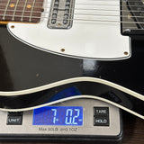 Used Fender Custom Shop 1960 Tele Custom Journeyman Relic Black w/ Matching Headstock on scale displaying weight.