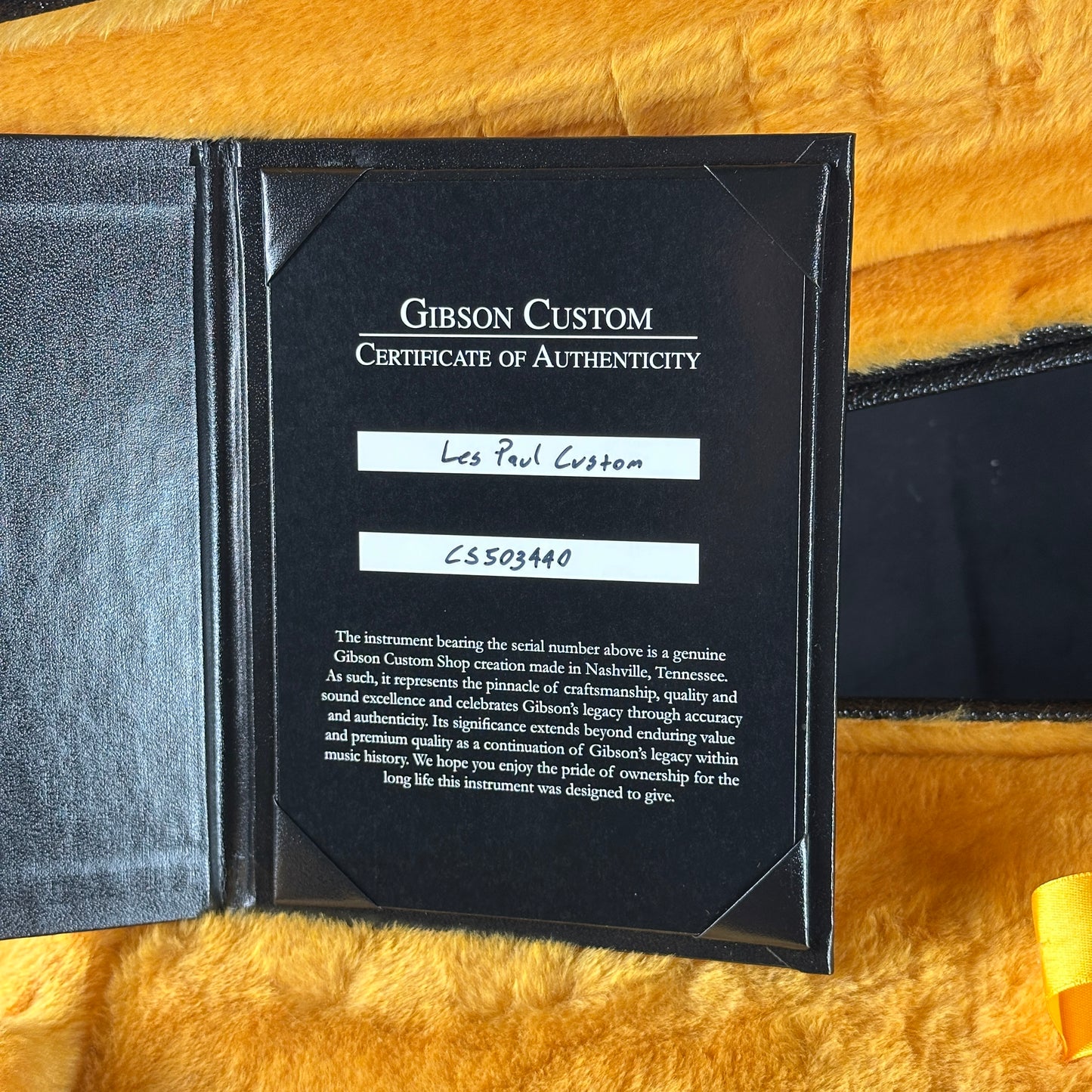 Gibson Custom Certificate of Authenticity on a textured surface