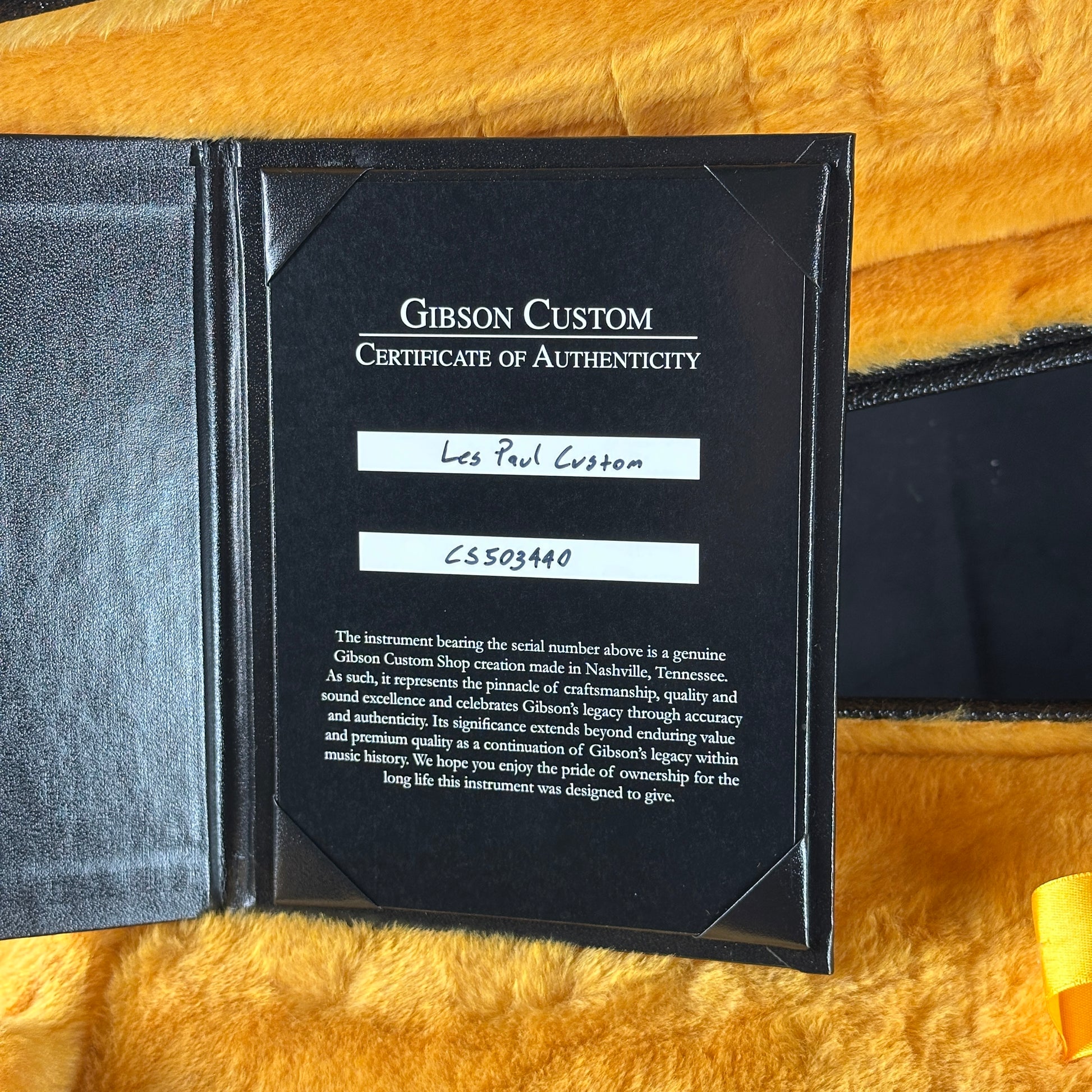 Gibson Custom Certificate of Authenticity on a textured surface