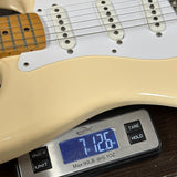 Used 1996 Fender Jimmy Vaughan White on scale displaying weight.