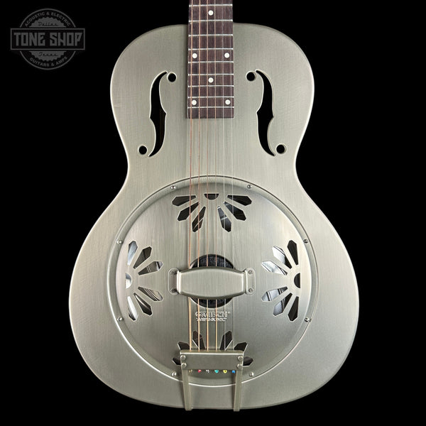 Silver resonator guitar on a black background with 'Tone Shop' logo.