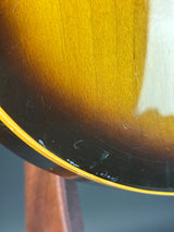 Close-up of a guitar body with a blurred background