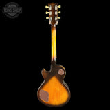 Back view of a vintage electric guitar with a sunburst finish on a black background, featuring the 'Tone Shop' logo.
