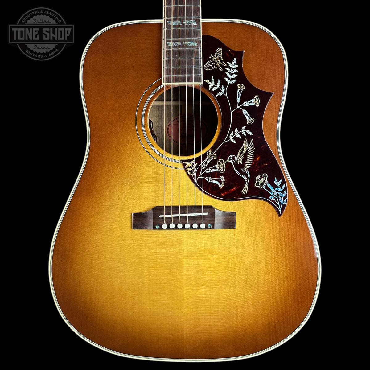 Front of Gibson Hummingbird Elegant Koa Honey Burst.
