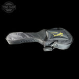 Gray guitar case with 'Gibson' branding on a black background