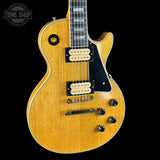 Front angle of Gibson Custom Limited 57 Les Paul Custom All Korina Antique Natural VOS.