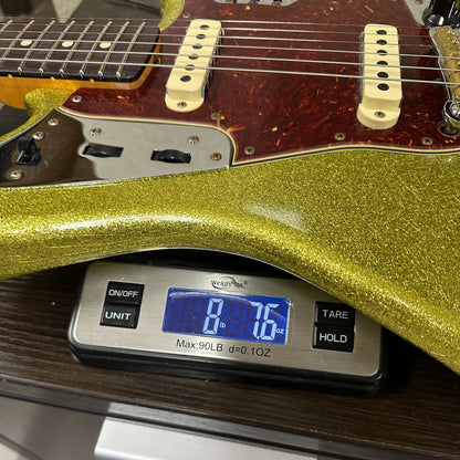 Fender Custom Shop 1962 Jaguar Journeyman Relic PHC CHSP on scale displaying weight.