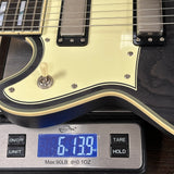 Guitar on a digital scale displaying weight