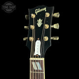 Headstock of Gibson Custom Made 2 Measure Dove Double Guard Trans Ebony Light Aged.