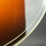 Ding on body of Used 2006 Gibson Western Classic Sunburst.