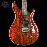 Glossy electric guitar with a prominent brand logo in the corner