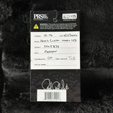 PRS Guitars label on a guitar with branding and product details.