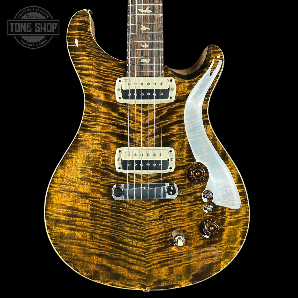 Wooden electric guitar with a visible brand logo on a black background