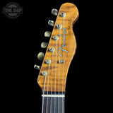 Fender guitar headstock with brand logo on a black background