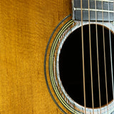 Wear near soundhole of Vintage 1960 Martin 000-28.