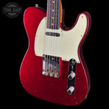 Red electric guitar with a white pickguard on a black background, featuring 'Tone Shop' logo.