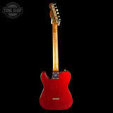 Red electric guitar with a black background