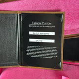 Gibson Custom Certificate of Authenticity on a pink background