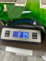PRS S2 Wood Library McCarty 594 Singlecut Quilt Eriza Verde on scale displaying weight.
