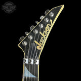 Guitar headstock with 'Jackson' branding on a black background