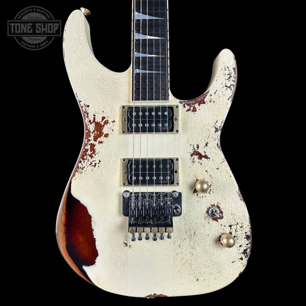Distressed electric guitar with a black background