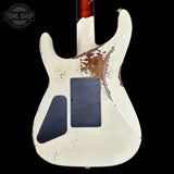 Worn electric guitar body with visible wear and tear on a black background, featuring 'Tone Shop' logo.