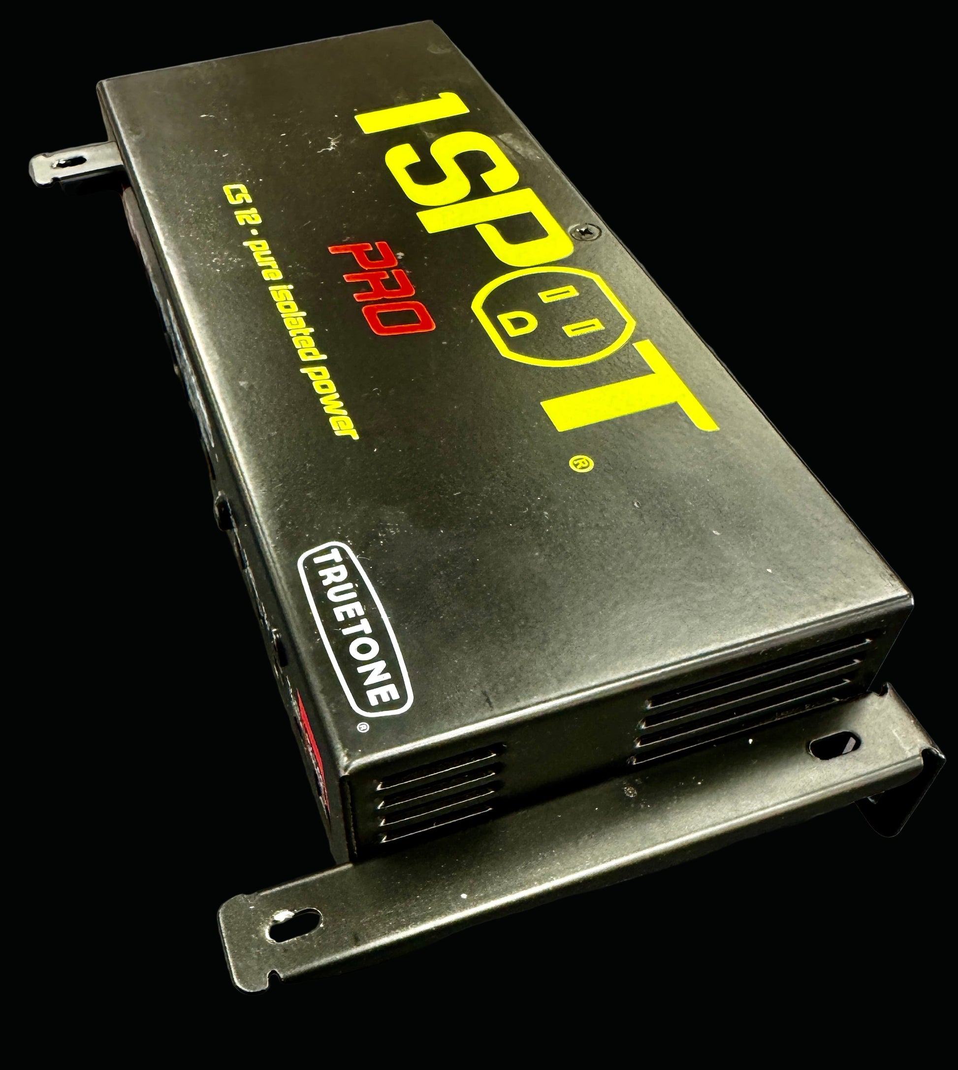 Electronic device with '1 Spot Pro' branding on a gray background