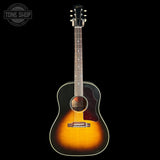 Acoustic guitar with a sunburst finish on a black background, featuring the Tone Shop logo.