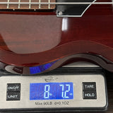 Used Supro Huntington I Piezo Short Scale Bass on scale displaying weight.
