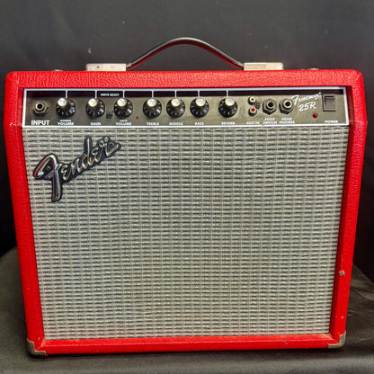 Fender guitar amplifier with red casing on a black background