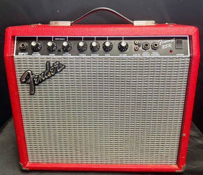 Fender guitar amplifier with red casing on a black background
