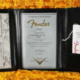 Fender certificate of authenticity with branding on a yellow textured background