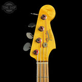 Headstock of Used 2013 Fender Custom Shop '64 Precision Bass Relic Red Sparkle over Sunburst.